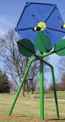 SCRAP METAL and a fertile imagination grow into this flower sculpture with bees. J.C. VENTIMIGLIA | Staff