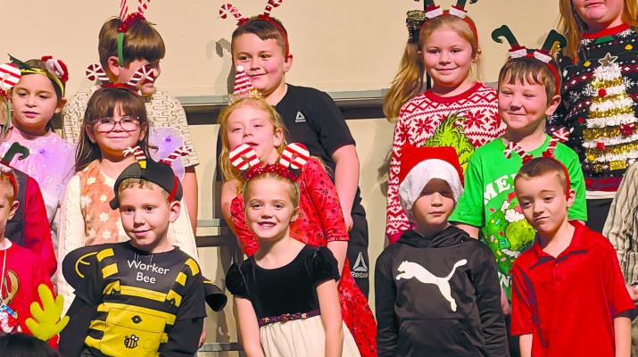 LEWIS ELEMENTARY first graders perform ‘A Bugz Christmas’ during a holiday program at the Excelsior Springs Performing Arts Center. MIRANDA JAMISON | Staff