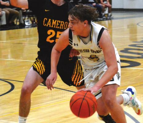 DUSTIN DANNER | Staff JUNIOR RAKAI GANTT gets around a defender on his way to the bucket during Excelsior Springs’ Nov. 30 meeting with visiting Cameron.