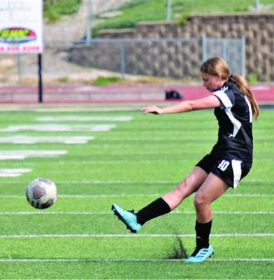 EXCELSIOR SPRINGS junior Abby Rash launches a free kick May 4 against Smithville at Tiger Stadium. TIM HARLAN | Submittedf