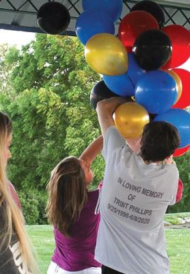 IN MEMORY of Trint Phillips, balloons are arranged around 8:30 p.m. on June 11 undera pavilion roof at Century Park in Excelsior Springs for a launch that takes place at dusk, about 45 minutes later. J.C. VENTIMIGLIA | Staff