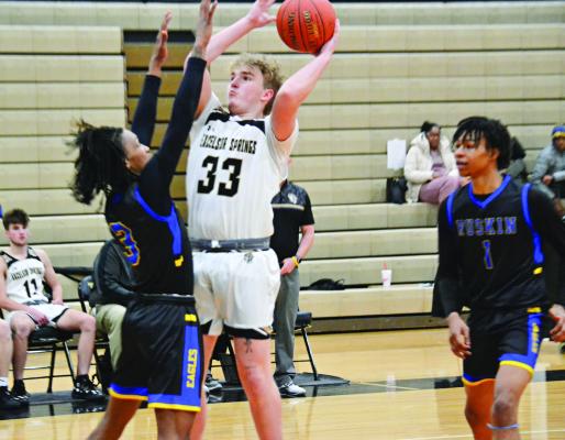 EXCELSIOR SPRINGS senior post player Trevor Stanton goes up for two points during the Tigers’ 100-60 Greater Kansas City Suburban Conference-Blue Division loss Feb. 3 to visiting Ruskin, a Kansas City-based school. DUSTIN DANNER | Staff