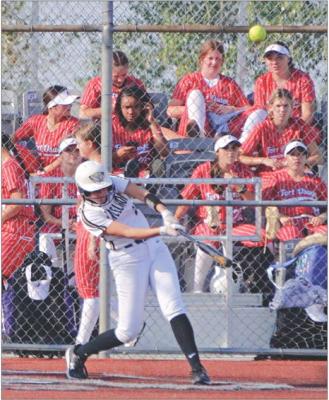 WITH A CROWD of Fort Osage softballers in the stands behind her, Excelsior Springs sophomore Kinley Rogers hits a home run to right-center field Sept. 12 at Miracle Field. DUSTIN DANNER | Staff