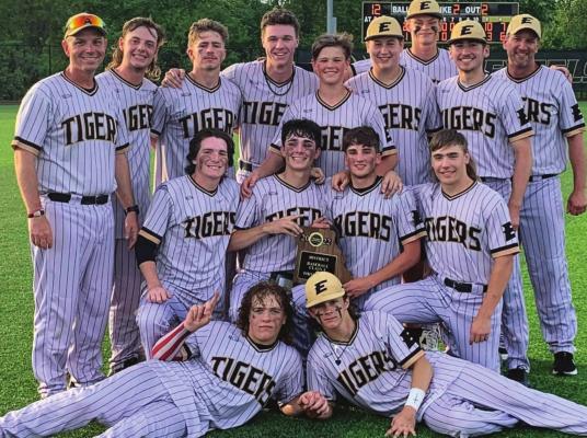THE TIGERS display their Class 4 District 15 championship plaque May 19 after defeating St. Pius X of Kansas City.