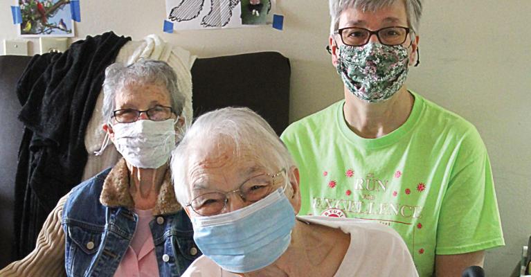 FOR THE FIRST time in a year, family members are able to get together in person with Mary Melvin at Valley Manor Nursing Home. From left are Evelyn Trickel, who is Melvin’s sister; Annette Tracy, Melvin’s daughter; and Melvin.