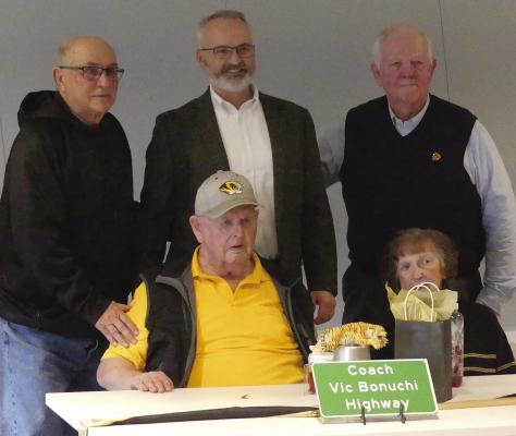 BENNY WIERZBICKI (from left), Vic Bonuchi, Doug Richey, Joann Bonuchi and Sam Brown celebrate the 69 Highway dedication honoring Coach Bonuchi. ELIZABETH BARNT | Staff