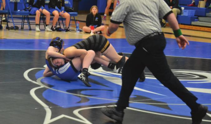 SENIOR PAIGE BARBER pursues a win Jan. 6 at Harrisonville. DUSTIN DANNER | Staff