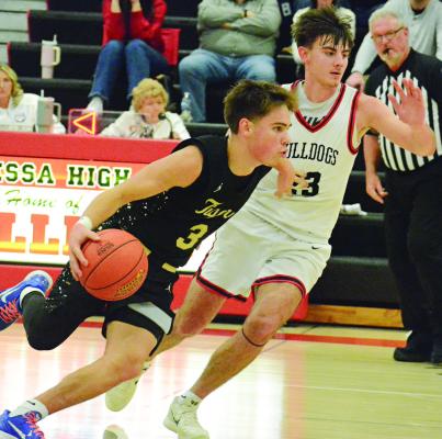 BOOKER O’NEILL (left) attempts to drive past Braden Kantner during Excelsior Springs’ varsity boys basketball clash with Odessa. SHAWN RONEY | Staff