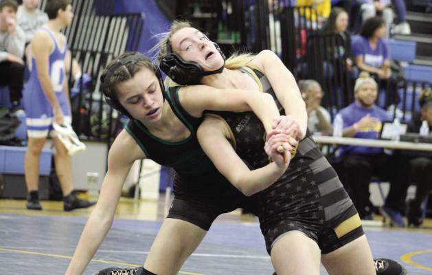 EXCELSIOR SPRINGS junior Alyssa Betts, right, works her way out of the bottom position in tournament action Dec. 28 at Center. DUSTIN DANNER | Staff