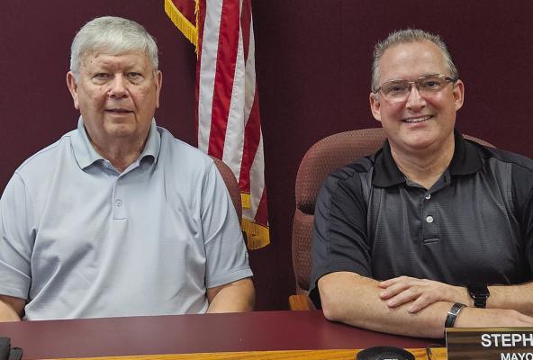 CITY COUNCILMAN John McGovern (left) and Mayor Pro-Tem Stephen Spear participate in the first city council meeting since the election. MIRANDA JAMISON | Staff