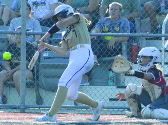 BELLA LOEFFERT (left) swings at a pitch during Excelsior Springs’ dramatic win over Chillicothe. SHAWN RONEY | Staff