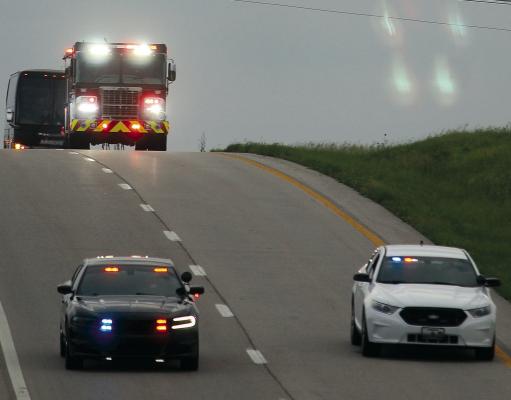 EXCELSIOR SPRINGS police and fire personnel escort the Tigers baseball team back into town following the team’s 2-0 victory over Orchard Farm in the Class 4 state championship game at the Ozark Mountain Sports Complex. The team returned to the high school for a community celebration with family, friends and supporters. Baseball coverage continues on page 6. MIRANDA JAMISON | Staff