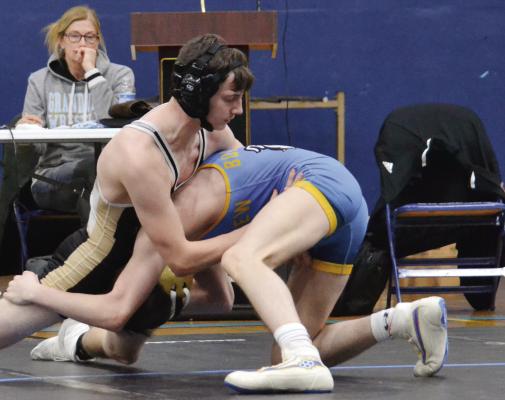 EXCELSIOR SPRINGS sophomore Dominick Betts, left, works to escape the grasp of his opponent en route to an 8-2 decision Jan. 18 at Grandview. DUSTIN DANNER | Staff