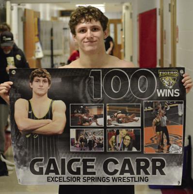 GAIGE CARR celebrates winning his 100th high school boys wrestling match. The senior achieved the feat during the Richmond Invitational. SHAWN RONEY | Staff