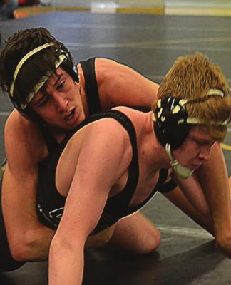 SENIOR DAMON ASHWORTH, up top, looks to return to state competition after last season’s title in the 152-pound division at the Class 2 state tournament. DUSTIN DANNER | Staff