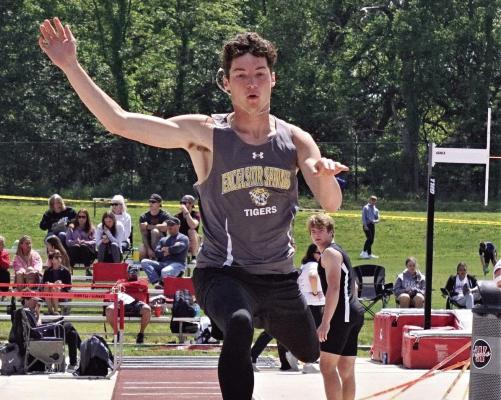 DALTON LAYTON, seen here jumping at a high school track and field meet, is moving on from Excelsior Springs to compete for Rockhurst University, an NCAA Division II program in Kansas City. DUSTIN DANNER | Staff