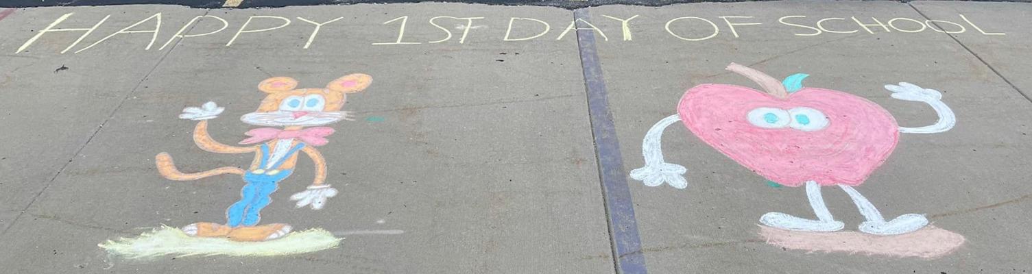 ROBBIE FARABEE enjoys sharing his artistic talent around Excelsior, such as these chalk art pieces in front of Lewis Elementary celebrating the first day of school. You can find Robbie’s work all around the downtown sidewalks.