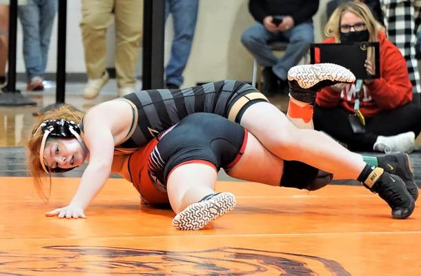 JUNIOR PAIGE BARBER posts her arm while trying to get her opponent’s shoulders to the mat in sectional action. TIM HARLAN | Submitted Photo