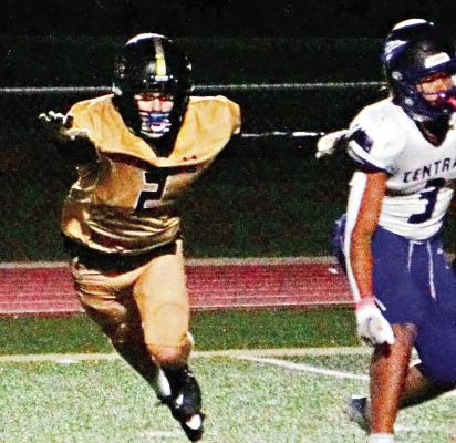 CARSON GHOLSON (left) stretches out in an attempt to block an extra-point kick during Excelsior Springs’ Oct. 6 meeting with visiting St. Joseph Central.