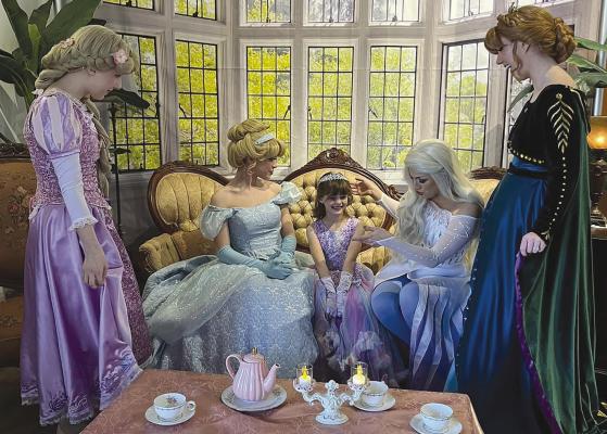 KENNADY LEMON meets the Disney princesses at a tea party event hosted by the Firefly Event Center. Submitted