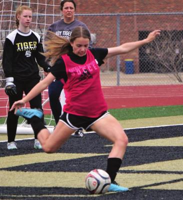 SOPHOMORE ABBY RASH, seen kicking, looks to be a key part of Excelsior Springs’ defense this spring. DUSTIN DANNER | Staff