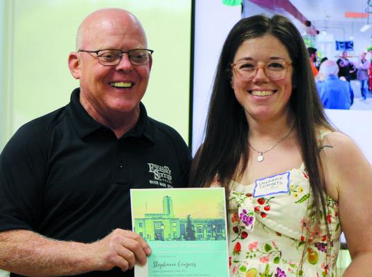 MAYOR MARK SPOHN (left) congratulates Stephanie Conyers for being the fifth citizen to complete the academy. SHARON DONAT | Staff