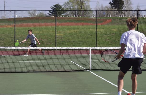 SENIOR MATTHEW REBELLO reaches out for a forehand return during Excelsior Springs’ April 13 home dual win over Benton of St. Joseph. DUSTIN DANNER | Staff