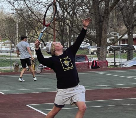 EXCELSIOR SPRINGS senior Lee Mueller serves an during the Tigers’ 5-4 dual victory of Lafayette County March 27 at Higginsville. DUSTIN DANNER | Staff