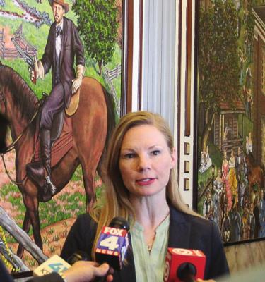 STATE AUDITOR Nicole Galloway talks with reporters after she delivers the Clay County Commission audit at Wednesday’s commission meeting in Liberty. J.C. VENTIMIGLIA | Staff