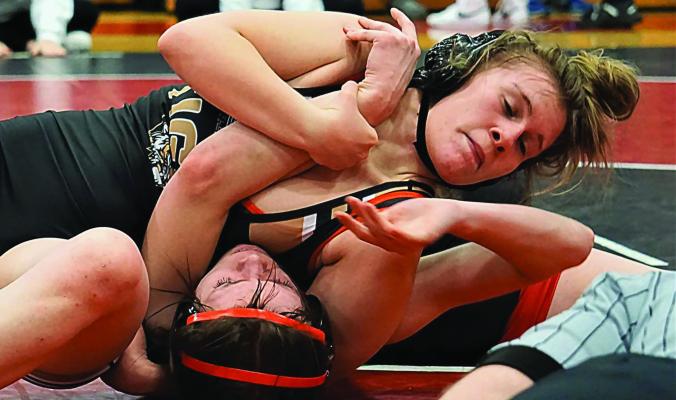 EXCELSIOR SPRINGS senior Vada Burton, seen here going for a pin earlier this season, is returning to state girls wrestling competition, having placed second in the 130-pound division at the Class 1 District 4 Tournament. DUSTIN DANNER | Staff