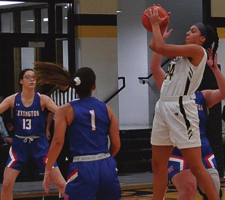 JUNIOR LILLIAN MAWBY goes up to receive a passing Excelsior Springs’ home opener against Lexington. DUSTIN DANNER | Staff