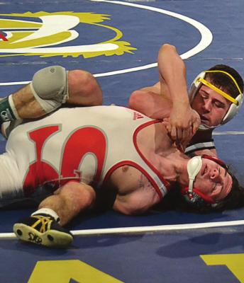 EXCELSIOR SPRINGS junior Ayden Dolt works his way to a win by fall March 11 in the Class 2 145-pound state title match in Independence. DUSTIN DANNER | Staff