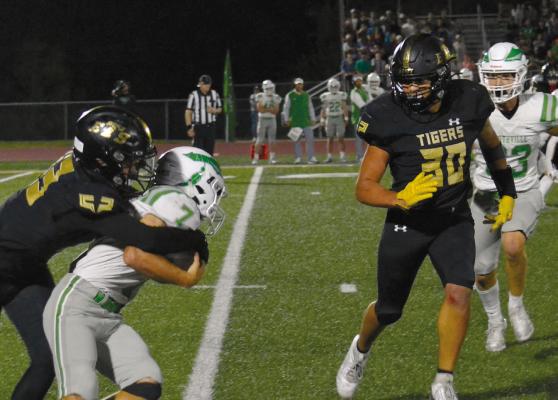 OWEN O’DELL makes a catch last Friday night as Dominic Rogers comes in to assist on the play. DUSTIN DANNER | Staff
