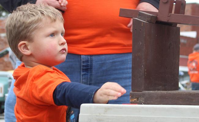 JACKSON SOOTER places his Hot Wheel on the starting block, ending the competition in third place. MIRANDA JAMISON | Staff