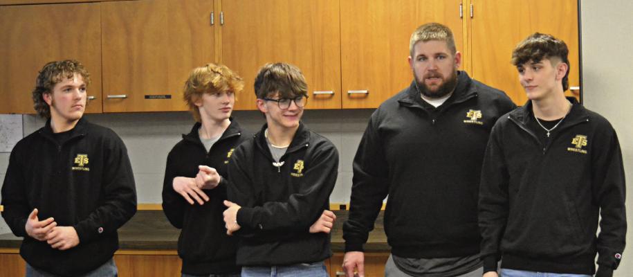 EXCELSIOR SPRINGS BOYS WRESTLING Coach Cody Beck (fourth from left) introduces the four wrestlers who grappled for the Tigers in the Class 2 state tournament to the Board of Education recently at the Support Services Center. Also shown are sophomore Hunter Scoma (from left), freshman Cooper Collins, sophomore Ryne Marcum and junior Micah Danner. DUSTIN DANNER | Staff