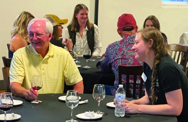 KENT POWELL (left) and Abi Douglas took the opportunity to network during the recent Chamber After Hours event. ELIZABETH BARNT | Staff