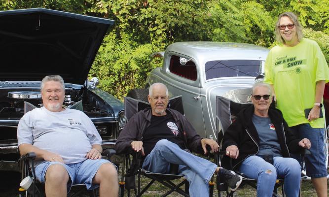 MIRANDA JAMISON | Staff CAR OWNERS Kent Spicer (from left), Tom Anderson, Rona Anderson and Mary Spicer check out the competition.