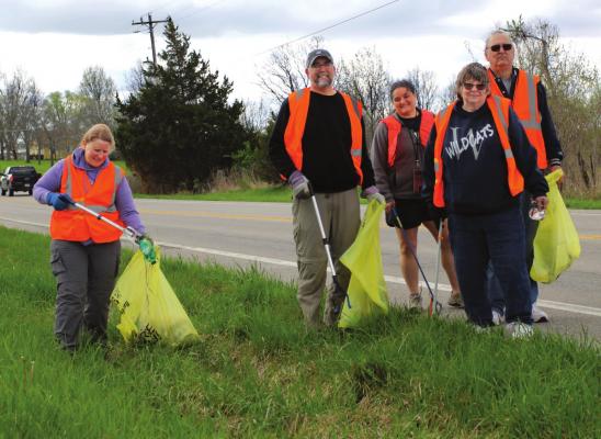 ENVIRONMENTALLY FRIENDLY “treasure hunters” – one of several groups along Missouri Highway 10 near Elkhorn Elementary School – include, from left, Melody Miser, Mike Smith, Jennifer House, Jim Cox and Sheryl Cox. J.C. VENTIMIGLIA | Staff