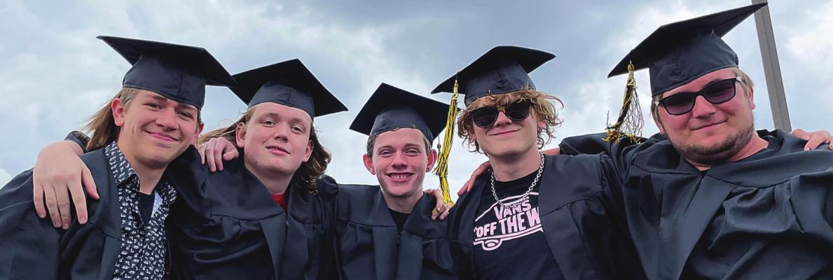 PRIOR to graduation is a parade that includes, from left, Jaden Henry, Zach Hagen, Hunter Elmore, Jacob Steele and Kai Anaya