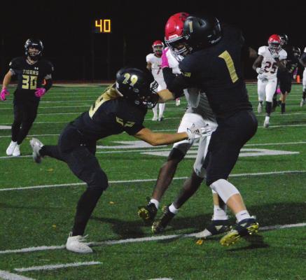 LED BY their stingy defense, the Tigers post a 30-15 Class 4 District 8 victory over Van Horn of Independence on Oct. 29 at Tiger Stadium. TARA ALTIS | Staff
