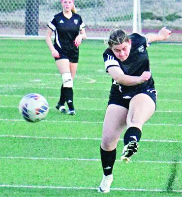 GRACIE CARDER directs the ball toward the goal for Excelsior Springs April 4 at Tiger Stadium. DUSTIN DANNER | Staff