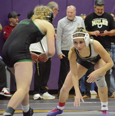 EXCELSIOR SPRINGS SENIOR Lillah Shue (right) looks to take a shot during her wrestleback semifinal match with Mid-Buchanan’s Molly Meehan in the 115-pound at the Class 1 District 4 Tournament. SHAWN RONEY | Staff