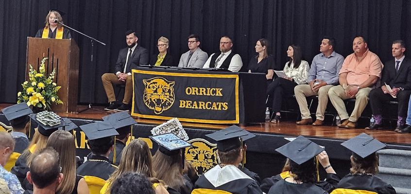 ORRICK HIGH SCHOOL graduates listen as speakers reflect on their achievements and offer advice for the future. MIRANDA JAMISON | Staff