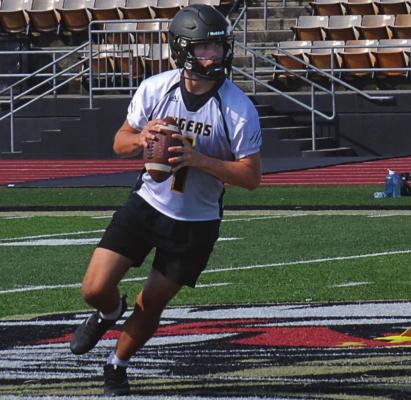 JUNIOR CHANCE MORELAND, seen rolling out in practice, is among the Tigers who receive postseason football honors. DUSTIN DANNER | Staff