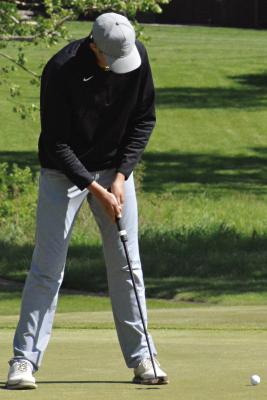 LANE OVERHOLTZER keeps his head down as he attempts a putt at the Class 3 District 4 Tournament. Overholtzer and Excelsior Springs teammate Landon Cramer are headed to state competition. SHAWN RONEY | Staff