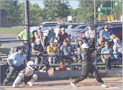 THE BALL jumps off Keira Romazon’s bat Sept. 3 as the Excelsior Springs junior smacks one of her three doubles to help the Tigers crush Cameron 14-2 at Cameron. DUSTIN DANNER | Staff