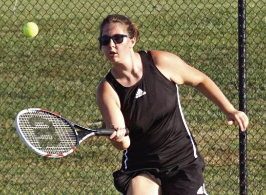 BEFORE SHELBY STODDEN and Malaya Tedesco repeat as Class 1 District 14 doubles champions for Excelsior Springs, the Tigers sweep Ruskin Sept. 27 at Excelsior Springs. Sophomore Mackenzie Hatfield, shown moving to the net for a drop shot, contributes to the sweep with an 8-6 singles victory. DUSTIN DANNER | Staff