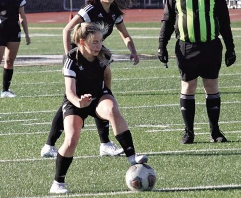 JUNIOR BAILEY CARDER, seen here gaining possession during an Excelsior Springs Tournament game at Tiger Stadium, has provided some of the scoring that has helped the Tigers win five of their last six games. DUSTIN DANNER | Staff