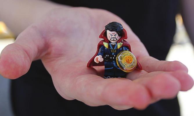 THIS CLOSEUP reveals details in Aidan Leroy’s Lego-compatible version of Dr. Strange, including mystical runes in the orange shield and the cape that climbs up to his ears and has been known to pet his face.
