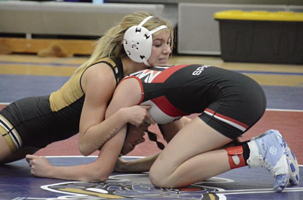 A FIRST-ROW bleacher seat works fine to capture photos of action on the mat. SHAWN RONEY | Staff